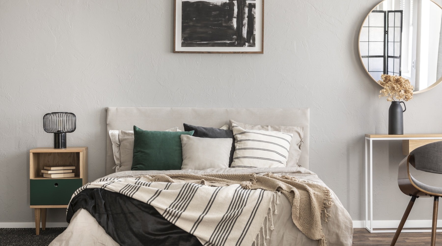 a bedroom with a bed and a desk with a chair