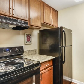 a kitchen with a refrigerator and stove